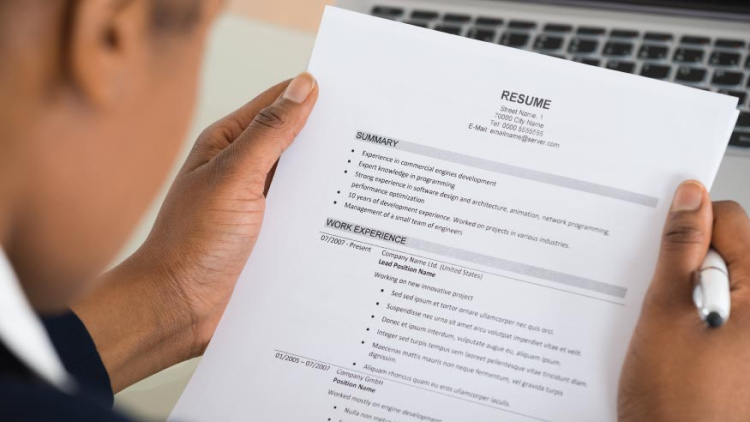 Person reading a resume