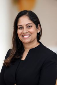 Photo of Shruti Jolly, Michigan Ross EMBA student wearing a black suit with a black shirt.