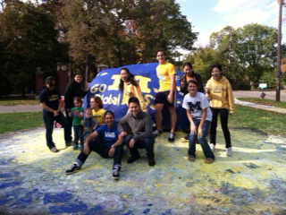 Ross exchange students participate in the University of Michigan student tradition of painting “The Rock.”