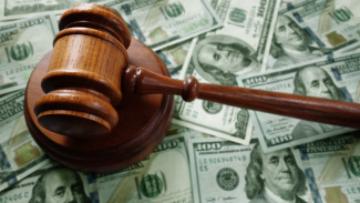 Photo illustration of judge's gavel and cash