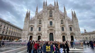 Group of BBA students standing in front a church in Milan, Italy