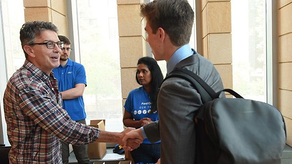 Fintech Conference student shaking hands